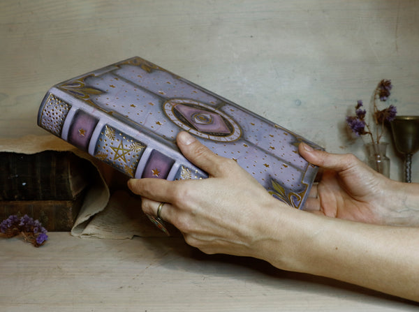 Purple leather journal with gold decoration, The Eye of the Universe