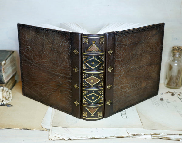 Large leather journal, Worn leather, Gold tooled decoration. The Old Book