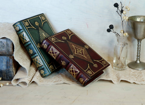 Set of 2 Small Leather Journals, Dark red and green leather with gold tooled decoration and antiqued paper. Antiquarian’s Notes