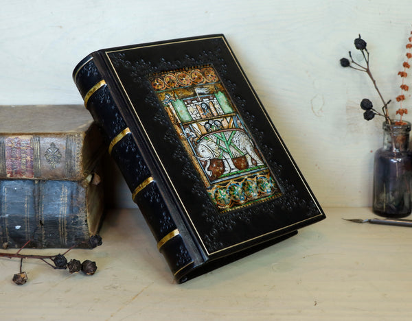 Black leather journal with painted Illuminated miniature and gold tooled decoration - Elephant and castle