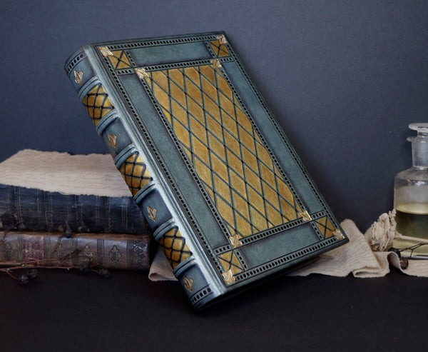 Grey leather journal with gold and black tooled decoration, Royal Mirage