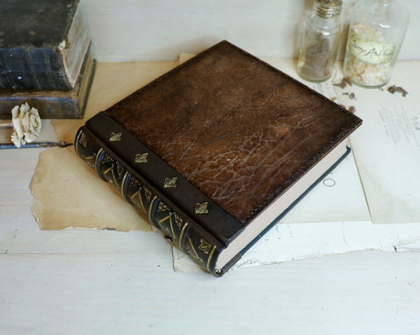 Large leather journal, Worn leather, Gold tooled decoration. The Old Book