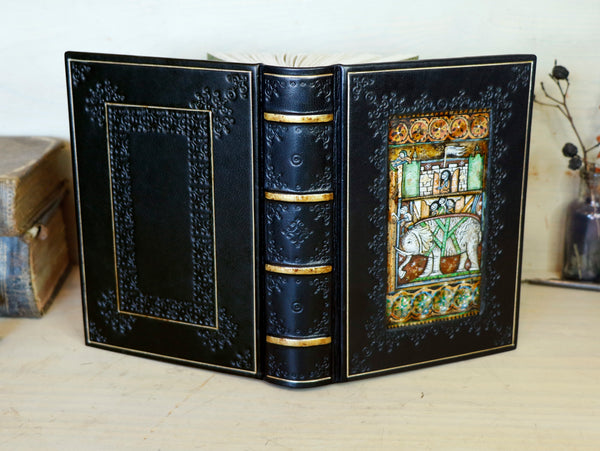 Black leather journal with painted Illuminated miniature and gold tooled decoration - Elephant and castle