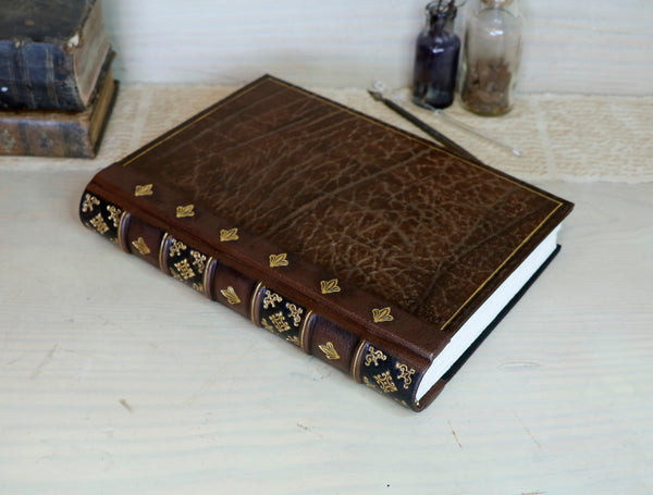 Large leather journal, Worn leather, Gold tooled decoration. The Old Book