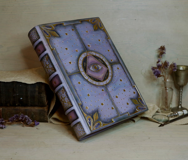 Purple leather journal with gold decoration, The Eye of the Universe