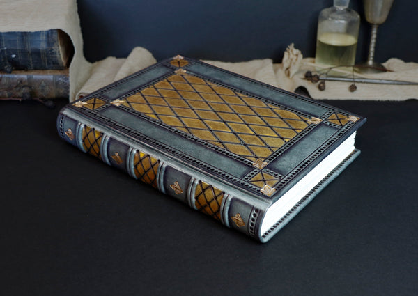 Grey leather journal with gold and black tooled decoration, Royal Mirage