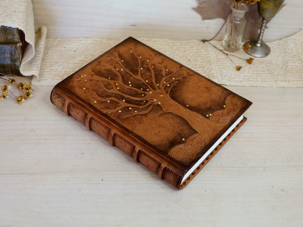 Antiqued brown leather journal with tooled decoration. The Cycle of Life