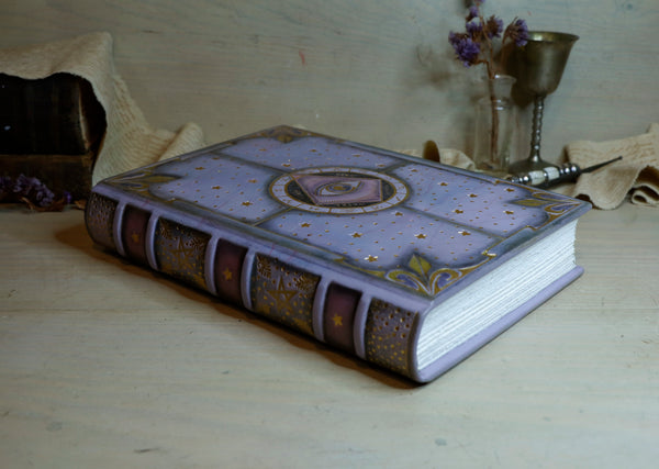 Purple leather journal with gold decoration, The Eye of the Universe