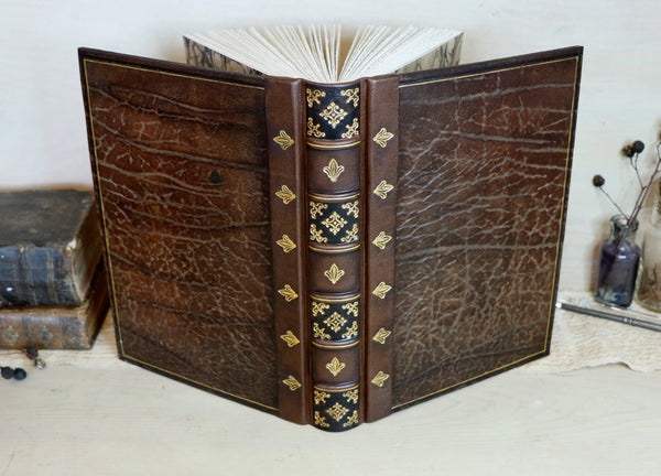 Large leather journal, Worn leather, Gold tooled decoration. The Old Book