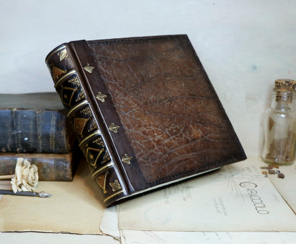 Large leather journal, Worn leather, Gold tooled decoration. The Old Book