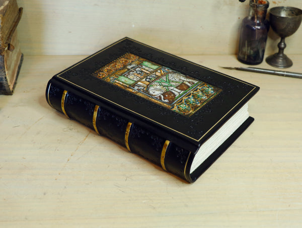 Black leather journal with painted Illuminated miniature and gold tooled decoration - Elephant and castle