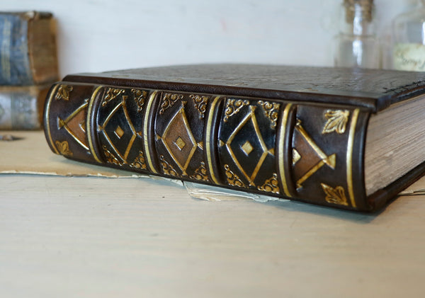 Large leather journal, Worn leather, Gold tooled decoration. The Old Book