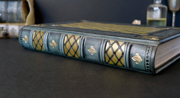 Grey leather journal with gold and black tooled decoration, Royal Mirage