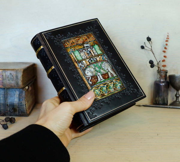 Black leather journal with painted Illuminated miniature and gold tooled decoration - Elephant and castle