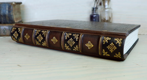 Large leather journal, Worn leather, Gold tooled decoration. The Old Book