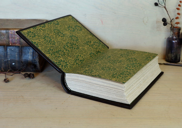 Black leather journal with painted Illuminated miniature and gold tooled decoration - Elephant and castle