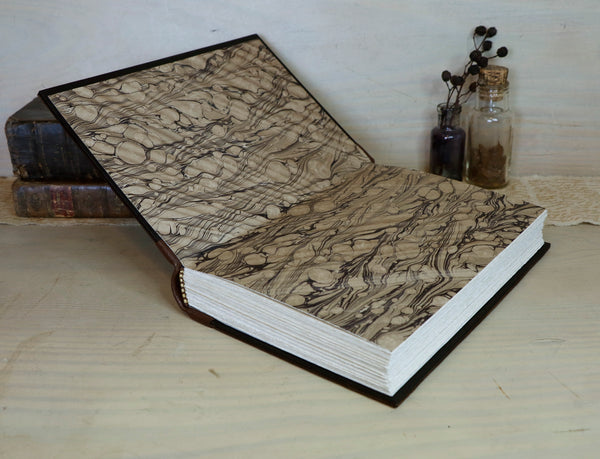 Large leather journal, Worn leather, Gold tooled decoration. The Old Book