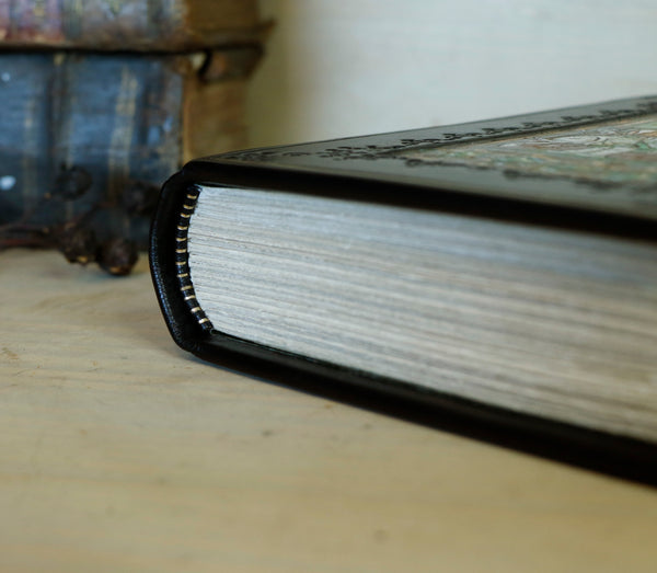 Black leather journal with painted Illuminated miniature and gold tooled decoration - Elephant and castle