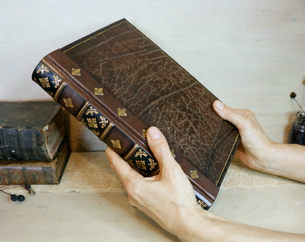 Large leather journal, Worn leather, Gold tooled decoration. The Old Book