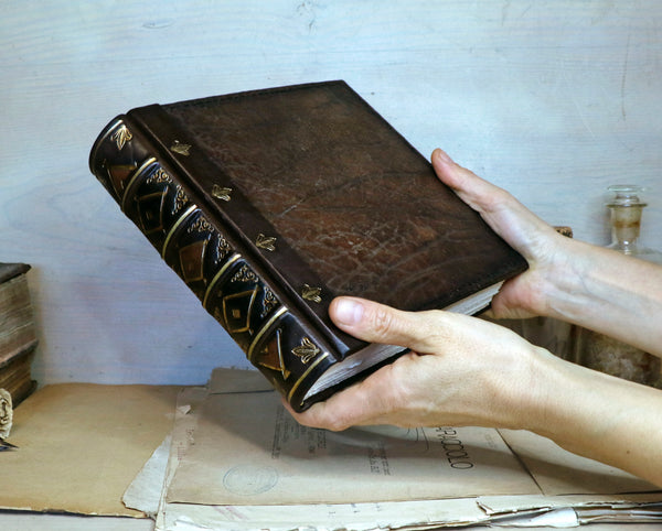 Large leather journal, Worn leather, Gold tooled decoration. The Old Book